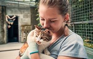 girl volunteering with cat