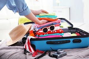 women packing for a vacation trip