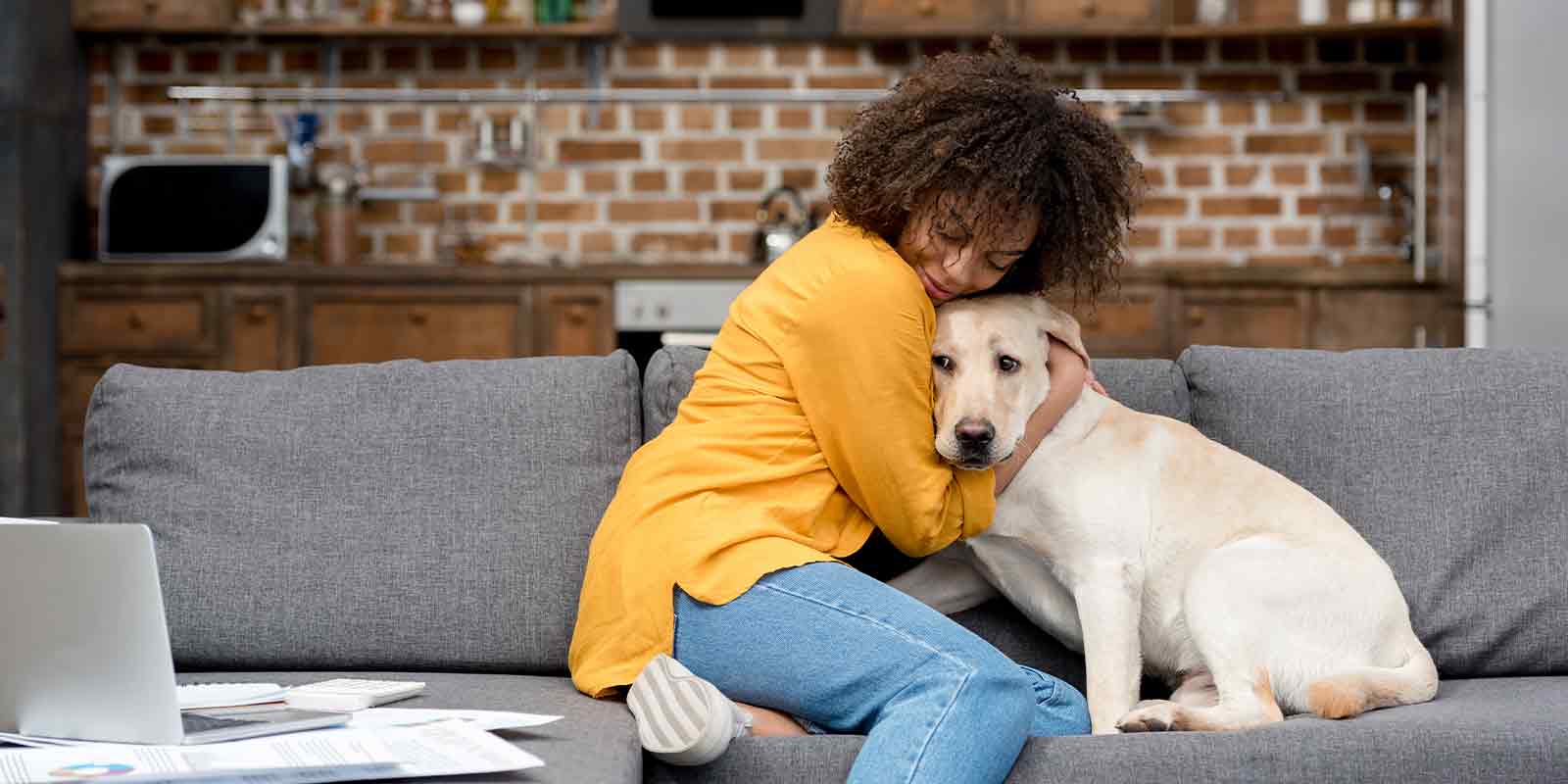 women hugging dog in her Pet-Friendly Places to Live in Northern V
