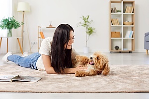 dog sitter on floor with puppy